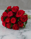 Bunch Of Lovely Red Roses In Craft Paper